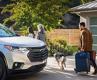 Family with luggage getting into SUV Family with luggage getting into SUV