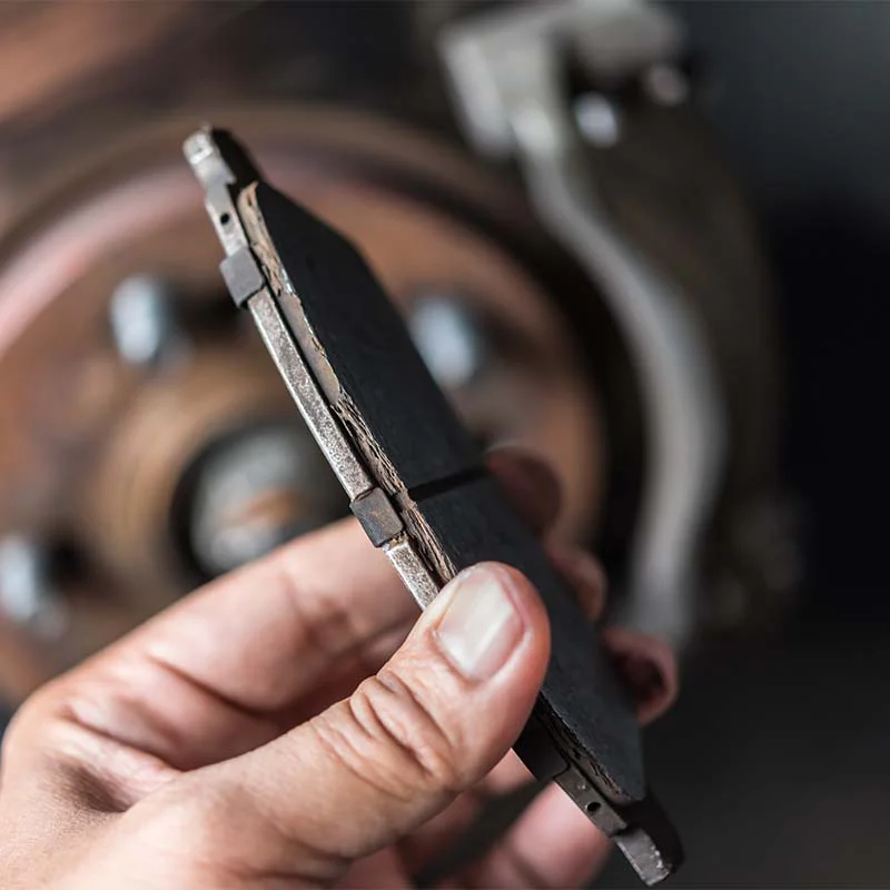 brake-6 Hand holding brake pad