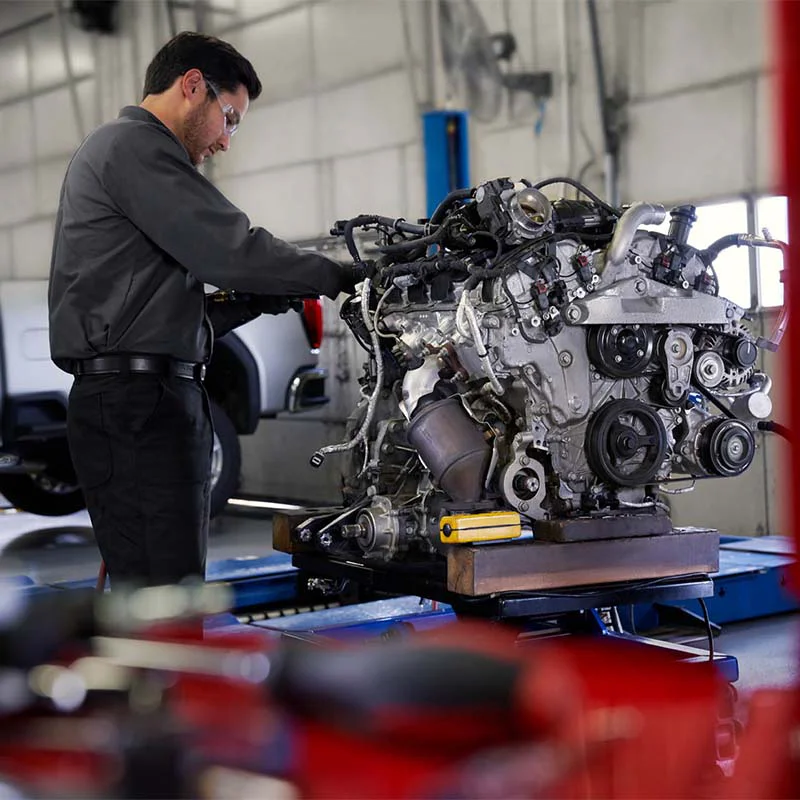 engine-repair-7-sq Mechanic working on engine