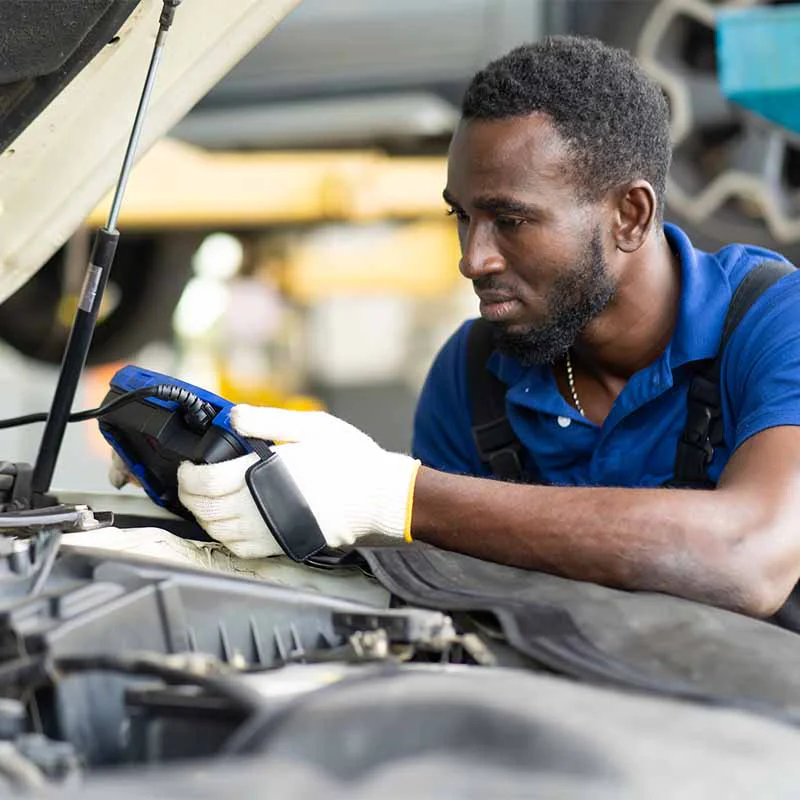 tune-up-3-sq Mechanic inspecting car engine bay