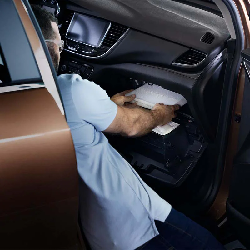 tune-up-5-sq Mechanic changing out cabin air filter