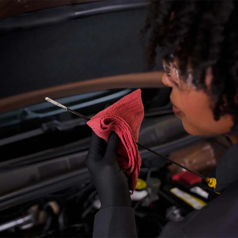 tune-up-6-sq Mechanic doing oil level check